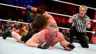 Styles applies the Calf Crusher to Lesnar's injured leg.